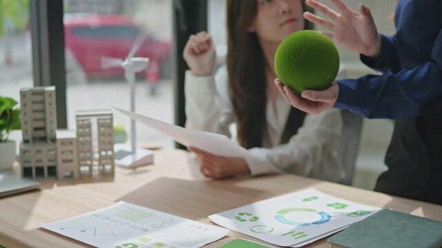 Sustainable business strategy meeting urban office collaborative discussion eco-friendly environment professional viewpoint esg focus