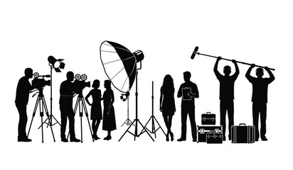 Black silhouettes of professional film crew members working on a movie production set together © ARSM D