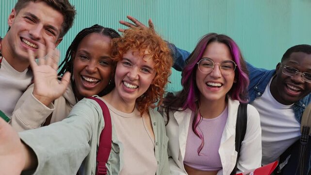 Happy multiracial students taking fun selfie video
