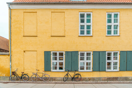 Yellow Row Houses In Nyboder District, Copenhagen, Denmark, Bicycles Parked