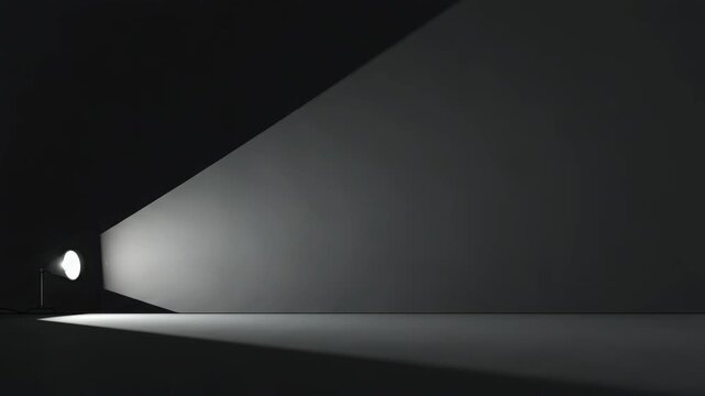 Spotlight illumination shining from lamp in dark room. Bright beam of light crossing empty wall. Abstract studio lighting effect for minimalist background design.
