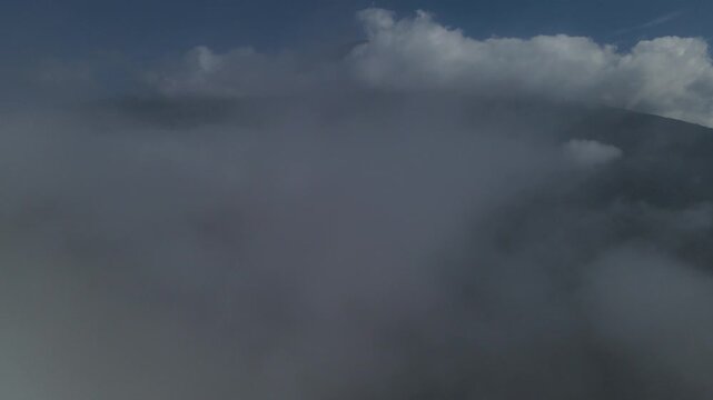 Drone Footage of Mount Slamet Slope Above Sea of Clouds at Sunrise, Indonesia