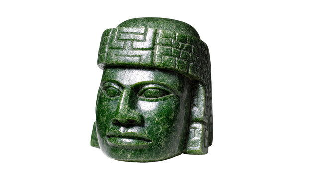 Isolated ancient dark green jade sculpture of a ceremonial head with ornate headdress