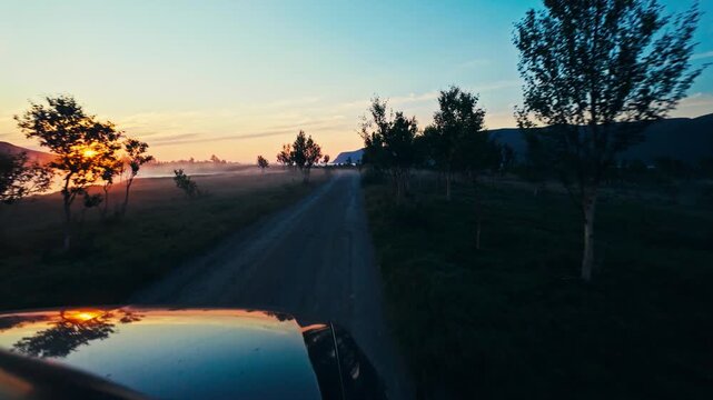 Driving Along a Quiet Country Road at Sunset in Sandland, Loppa Municipality, Finnmark, Norway - POV Shot