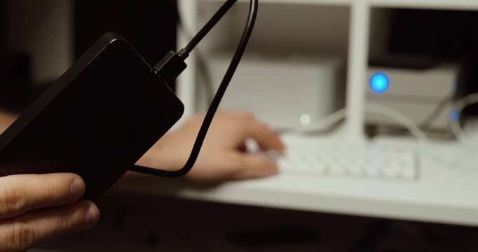 connecting an external hard drive to a computer for data backup.