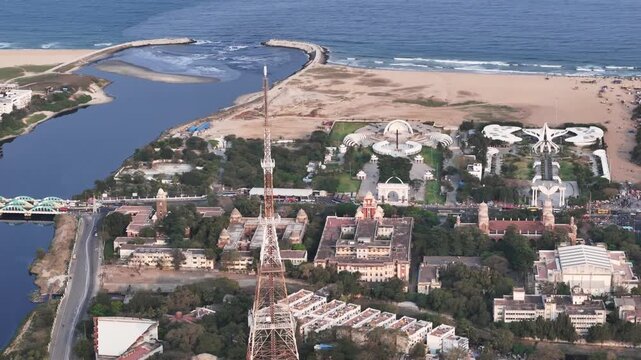 Aerial view of Chennai&rsquo;s Marina coastline, capturing the Cooum River mouth, Island Grounds with the historic TV tower, and the MGR Memorial complex beside the Bay of Bengal.