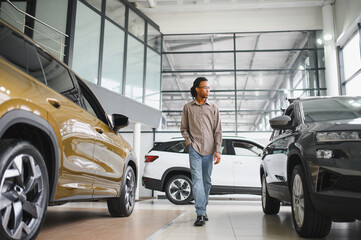 African american Man buying a car at a showroom