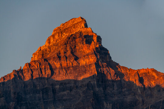 Sunrise light on mountain peak at Lake Moraine Alberta Canada