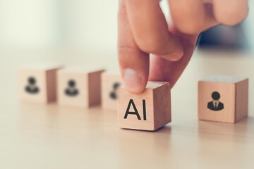 Artificial intelligence transforming human resources. Placing AI wooden blocks among human icons. AI transforming human resources, recruitment automation, workforce transformation, the future of work.