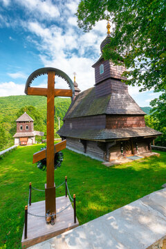 likitsary, transcarpathia, ukraine - 02 jul 2020: traditional wooden church architecture. picture of an old building made from timber in summer landscape under blue sky. religion heritage of ukraine
