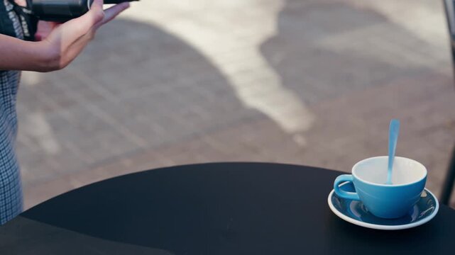 Video of close up of customer using her credit card to make payment with electronic reader on a bar terrace