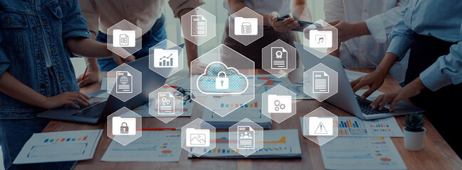 A diverse group of professionals engages in collaborative work using various devices, surrounded by...