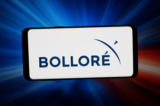 Stuttgart, Germany - 03-13-2026: In this photo illustration, the logo of French logistics company Bollore SE is displayed on a smartphone in front of abstract background on computer screen.
