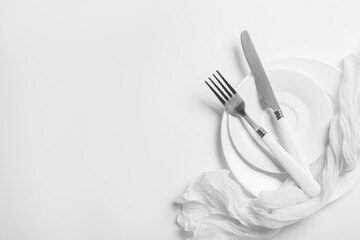 Naklejka premium Table setting with silver cutlery on white background