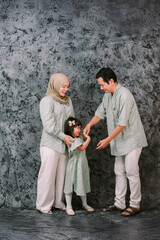 Cheerful Muslim Family Portrait Celebrating Togetherness and Joy