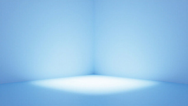 Empty minimalist blue studio corner with soft spotlight from above.