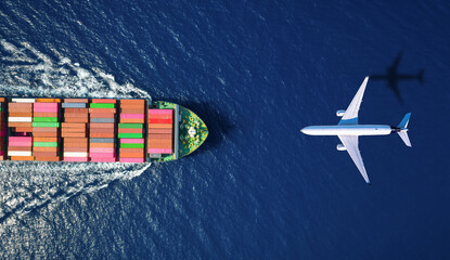 Aerial overhead view of a large container ship and airplane traveling over the ocean as a concept for transport and cargo © moofushi