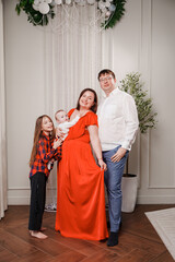 Family celebration in a decorated indoor space with kids and baby