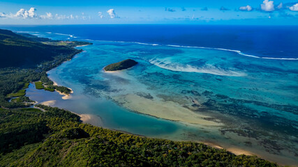 Aerial view of Mauritius island and Le Morne Brabant mountain with beautiful blue lagoon and underwater waterfall illusion © SASITHORN