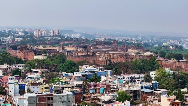15th century bidar fort with buildings, trees, fog and sky at karnataka, india. day time, push in shot, drone shot, 4k.