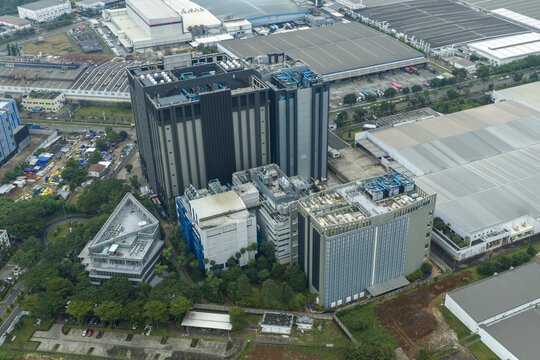 Aerial view of large data center buildings and surrounding industrial park infrastructure, Jakarta, Indonesia.