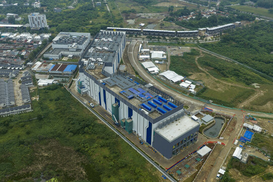 Aerial view of large modern data center building providing critical internet infrastructure, supporting global digital services and cloud computing, Jakarta, Indonesia.