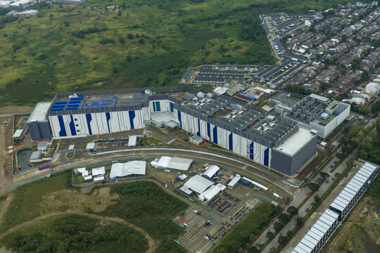 Aerial view of large contemporary datacenter facility providing critical infrastructure for digital information and cloud technology, Jakarta, Indonesia.