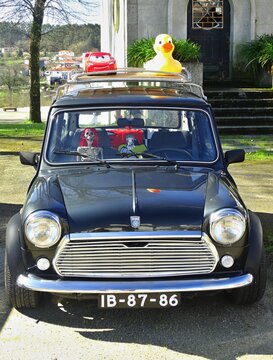 Mini Cooper classic driving quirky skeleton passenger, duck