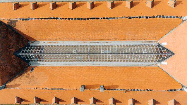 Aerial view of the striking roof architecture where red tiles meet glass, creating a captivating pattern of light and shadow, Petrovaradin, Vojvodina, Serbia.
