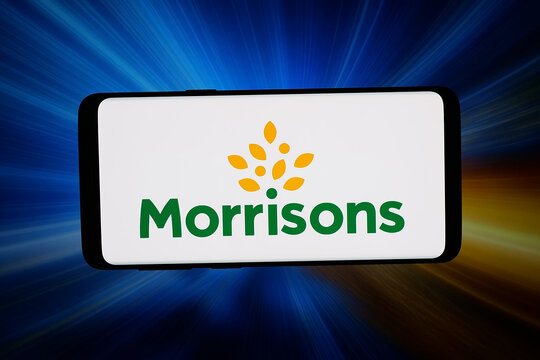 Stuttgart, Germany - 03-13-2026: In this photo illustration, the logo of Wm Morrison Supermarkets Limited (Morrisons) is displayed on a smartphone in front of abstract background on computer screen.