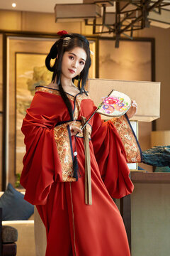 Asian beauties dressed in Hanfu (Warring States period robes) and Weixian paper-cutting