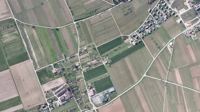 Aerial view of agricultural land with varied textures and tones creating a patchwork across the scene, Mittelwihr, Grand Est, France.