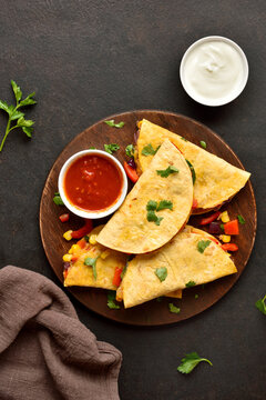 Delicious quesadilla with fresh vegetables served with sauce