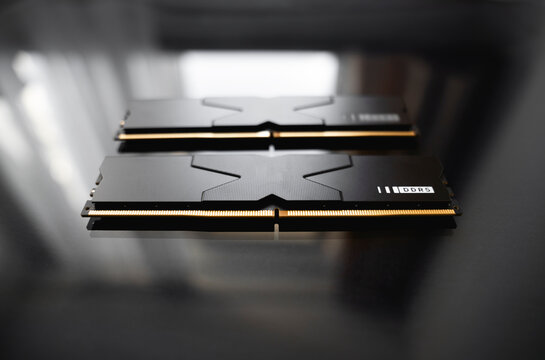 14 March 2026 - Wrocław, Poland. A Wilk Elektronik GOODRAM IRDS DDR5 RAM memory module placed on a dark, glossy surface.  