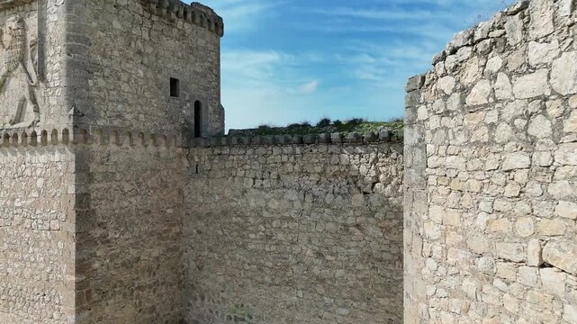 Aerial drone footage of the medieval Castle of Barcience and surrounding countryside landscape in Toledo province Spain