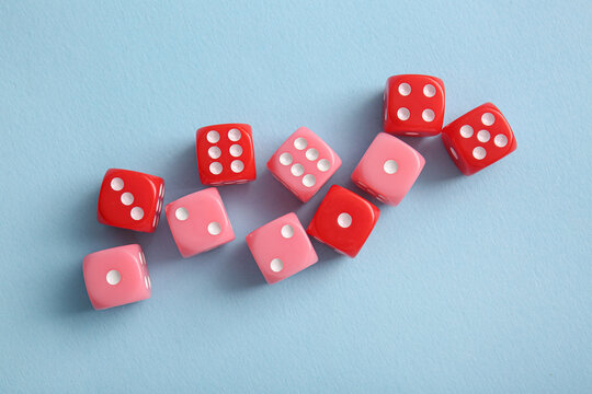 Different game dices on blue background