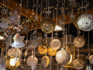 Naklejka premium Christmas Angel Ornaments And Golden Glitter Baubles, Bolzano, Italy