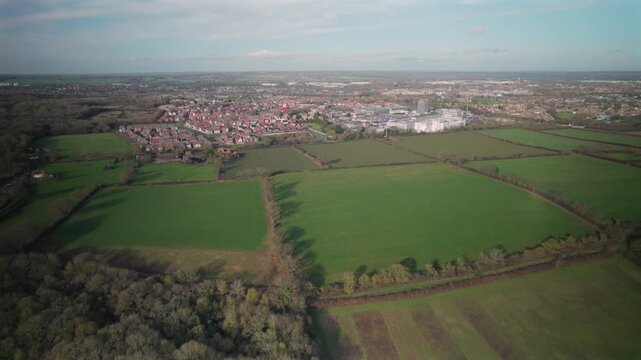 Aerial Drone View of Countryside Fields Leading to Expanding Essex Town