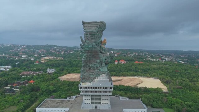 Majestic aerial view of the enormous garuda wisnu kencana statue on a cloudy day. This impressive monument is a famous cultural landmark in bali