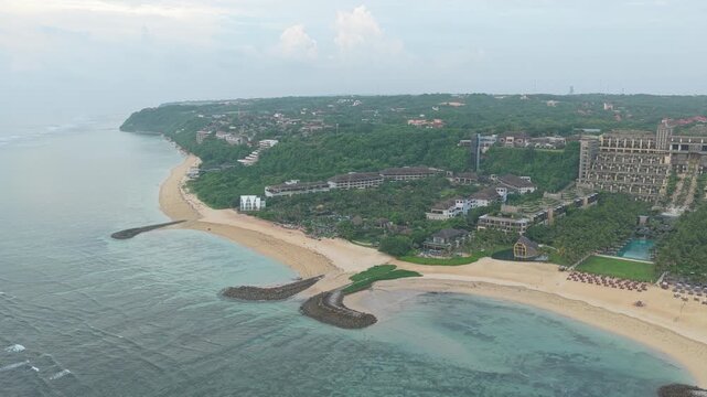 Amazing panoramic view of the tropical coast of nusa dua in bali. Beautiful sandy beach with luxury hotels and turquoise ocean water
