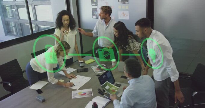 Animation of flowchart of icon over diverse coworkers sharing ideas in office