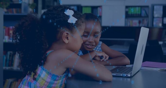 Two girls leaning at laptop, girl touching touchpad initiating blue overlay guiding school learning
