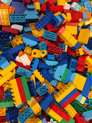 Naklejka premium Colorful plastic building blocks pile