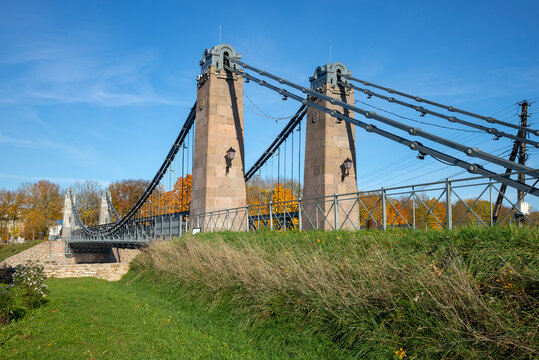 Span of the old chain bridge. Ostrov City, Pskov Region, Russia