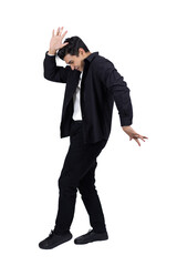 Young man in a suit making a funny dance move