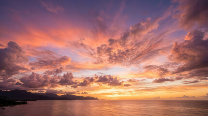 Obraz premium Stunning Sunset Over the Ocean with Vibrant Cloudscape and Distant Horizon