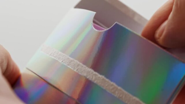 Unboxing a shiny package with a colorful design