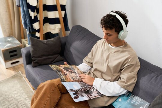 Stylish teenager enjoying quiet moments at home while reading interesting magazines