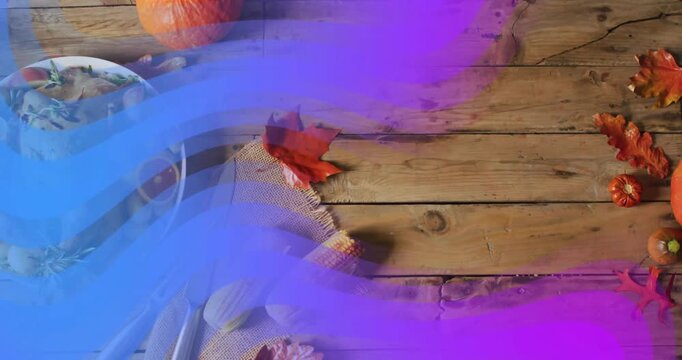 Roasted turkey with vegetables on Thanksgiving dinner table, colorful wave animation