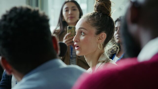 Woman speaks at business conference.